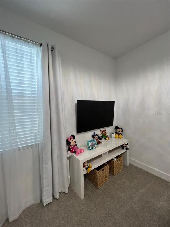 2252 Celebration Boulevard Celebration, FL 34747 - Photo 26 of 40 a bedroom with a workspace