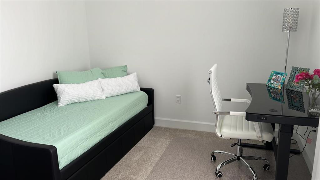 2252 Celebration Boulevard Celebration, FL 34747 - Photo 28 of 40 a view of a room with a table and chairs