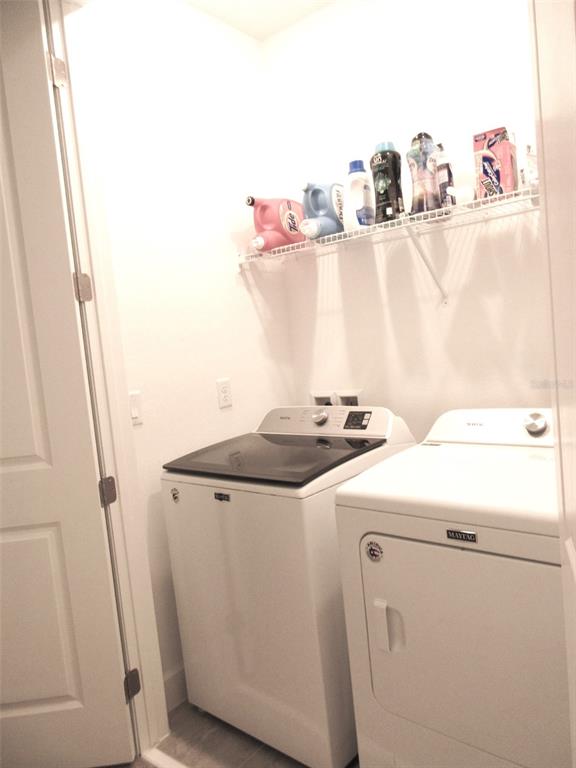 2252 Celebration Boulevard Celebration, FL 34747 - Photo 29 of 40 a utility room with dryer and washer