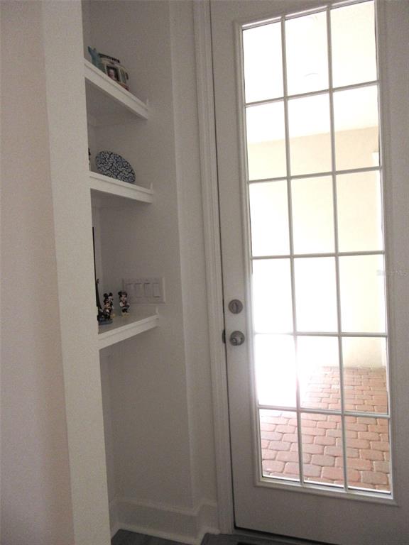 2252 Celebration Boulevard Celebration, FL 34747 - Photo 32 of 40 a room with a window and shelf