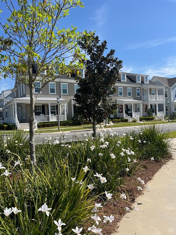 2252 Celebration Boulevard Celebration, FL 34747 - Photo 40 of 40 a front view of a residential apartment building with a yard