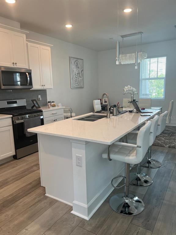 2252 Celebration Boulevard Celebration, FL 34747 - Photo 7 of 40 a kitchen with a sink a counter top space and appliances
