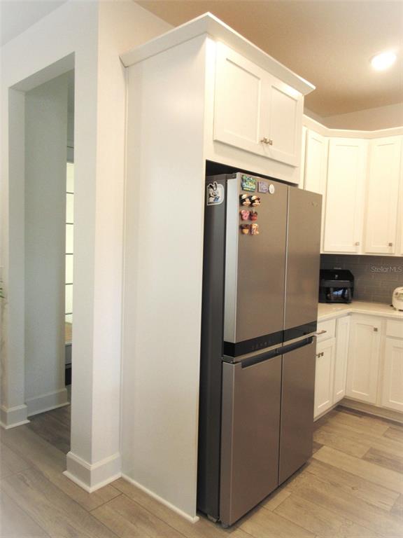 2252 Celebration Boulevard Celebration, FL 34747 - Photo 9 of 40 a white refrigerator freezer sitting in a kitchen