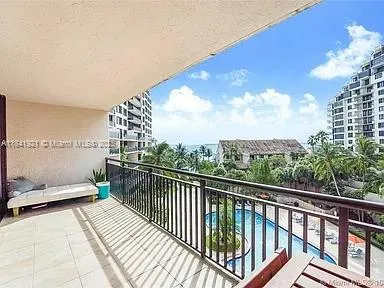 a view of swimming pool having outdoor seating