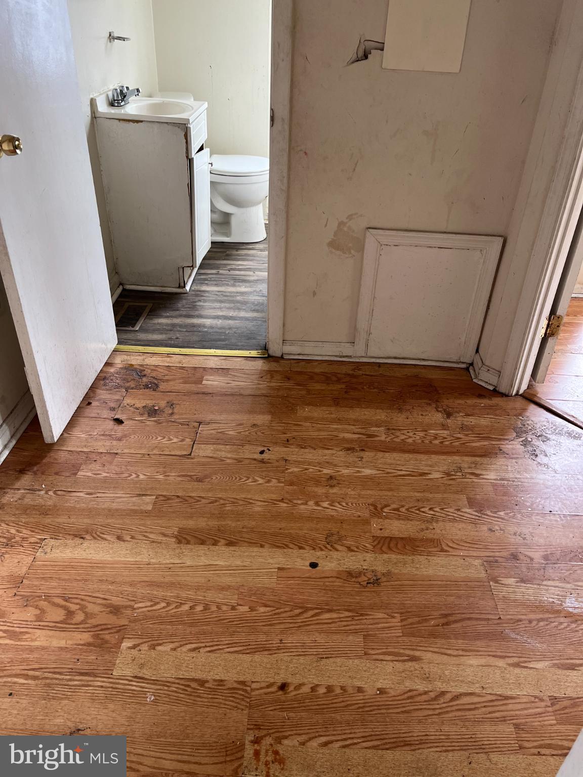 3601 9th Street Baltimore, MD 21225 - Photo 12 of 24 a view of a room with wooden floor and sink