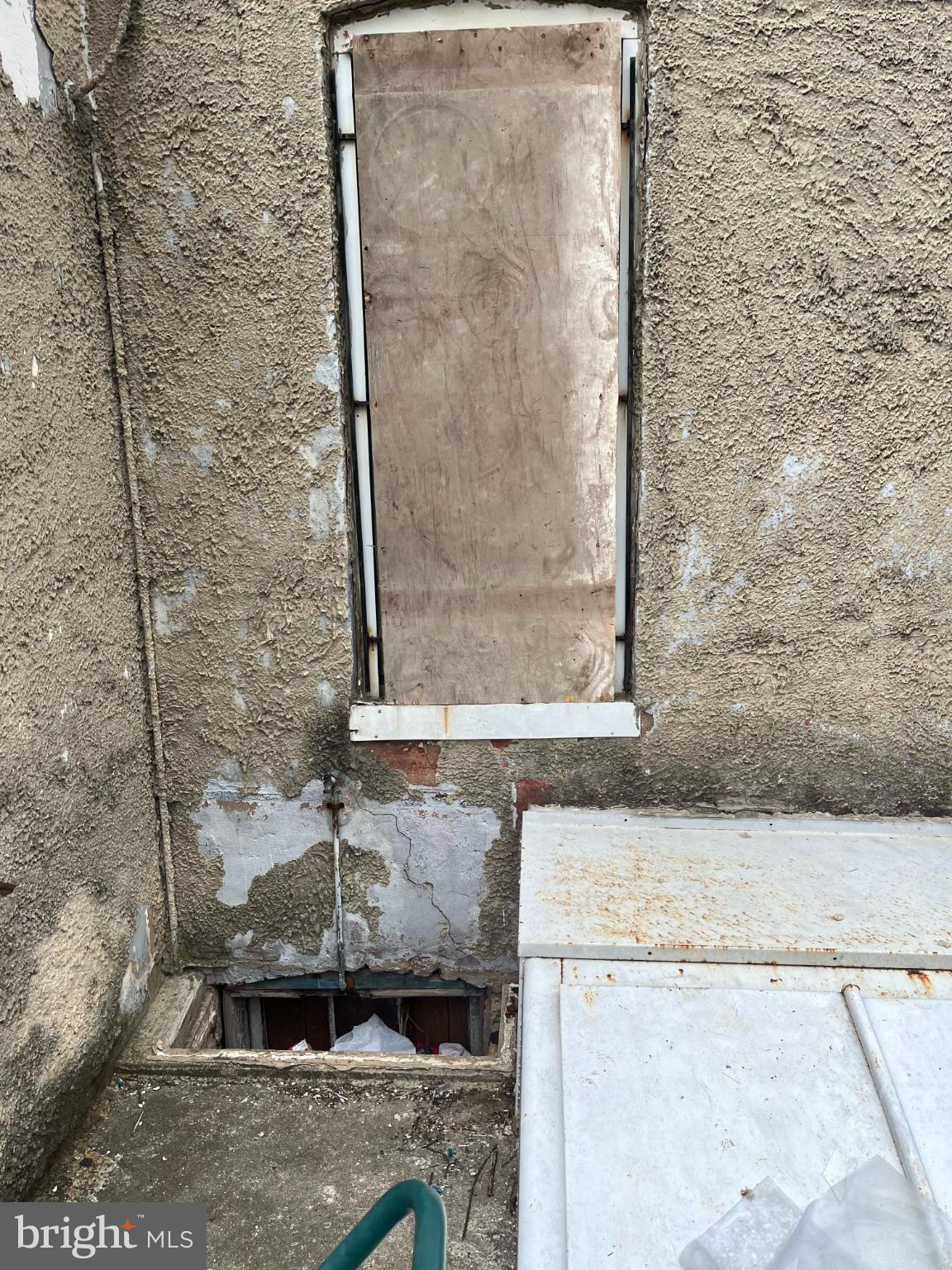 3601 9th Street Baltimore, MD 21225 - Photo 14 of 24 a bathroom with a granite countertop sink a mirror and shower