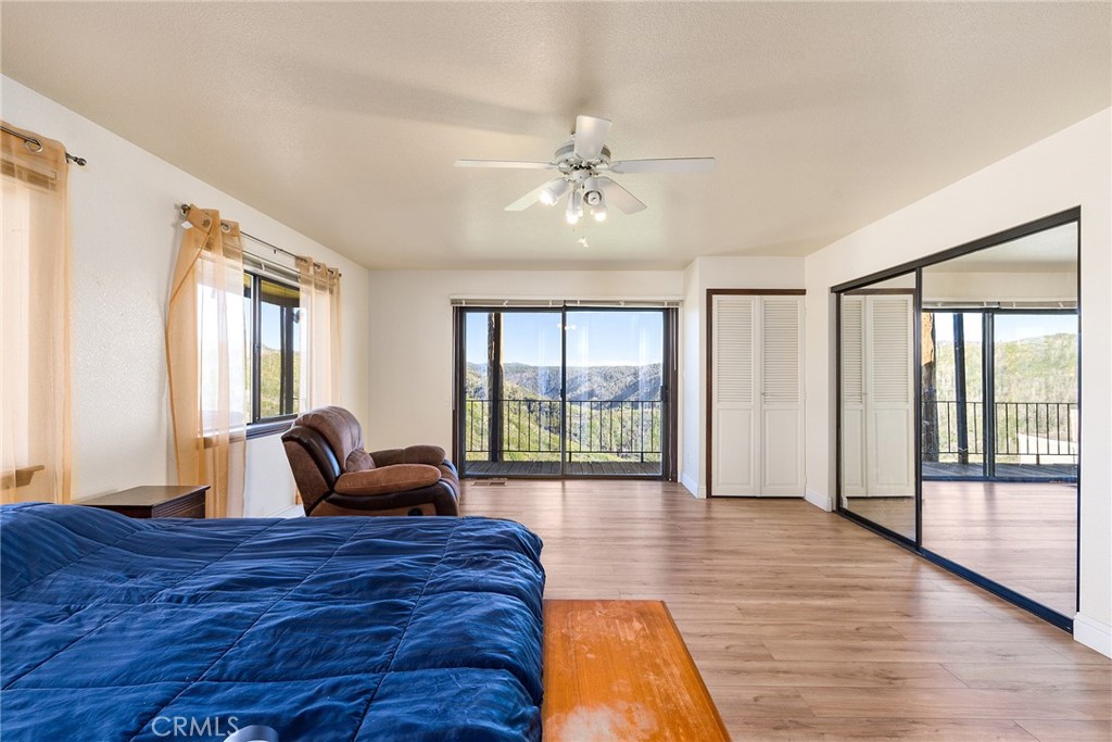 2114 Lumpkin Road Oroville, CA 95966 - Photo 12 of 25 a bed room with a bed and a large window