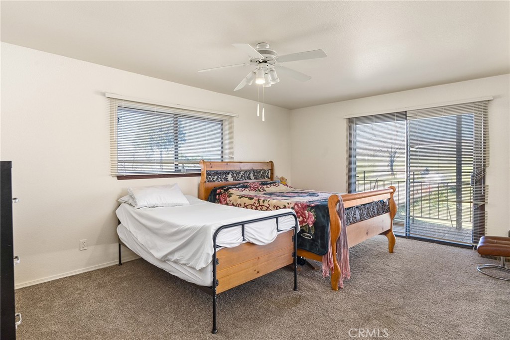 2114 Lumpkin Road Oroville, CA 95966 - Photo 16 of 25 a bedroom with a bed and a table