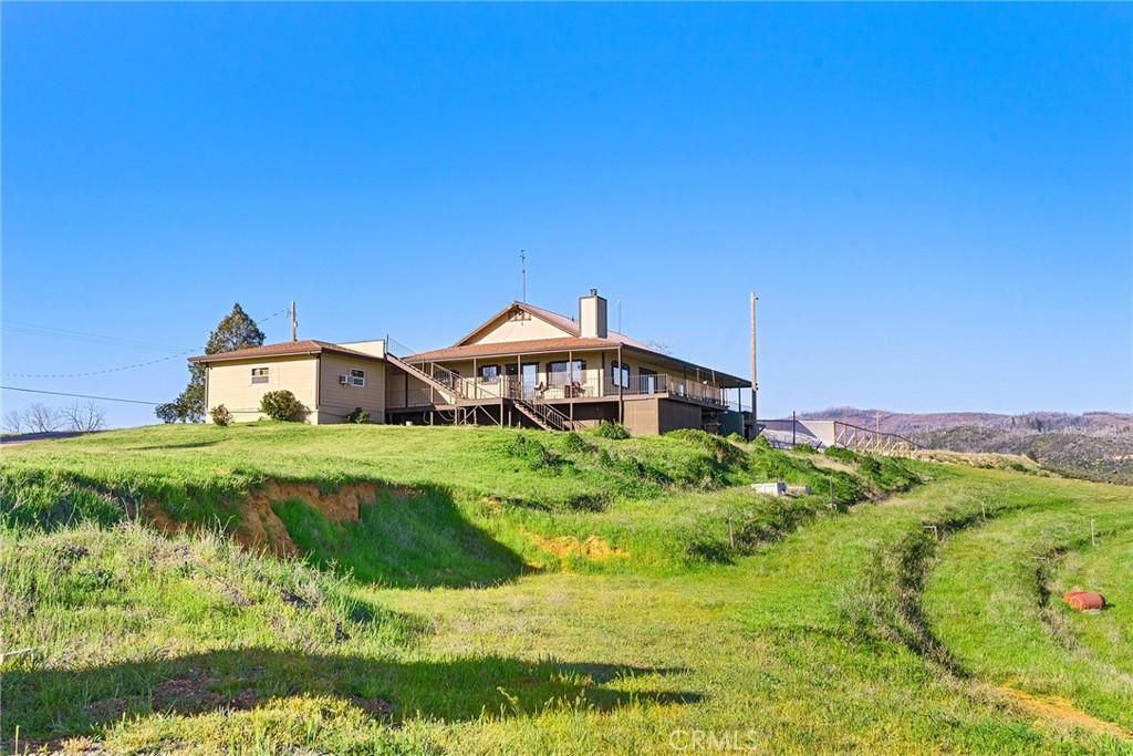 2114 Lumpkin Road Oroville, CA 95966 - Photo 3 of 25 a front view of a house with a yard