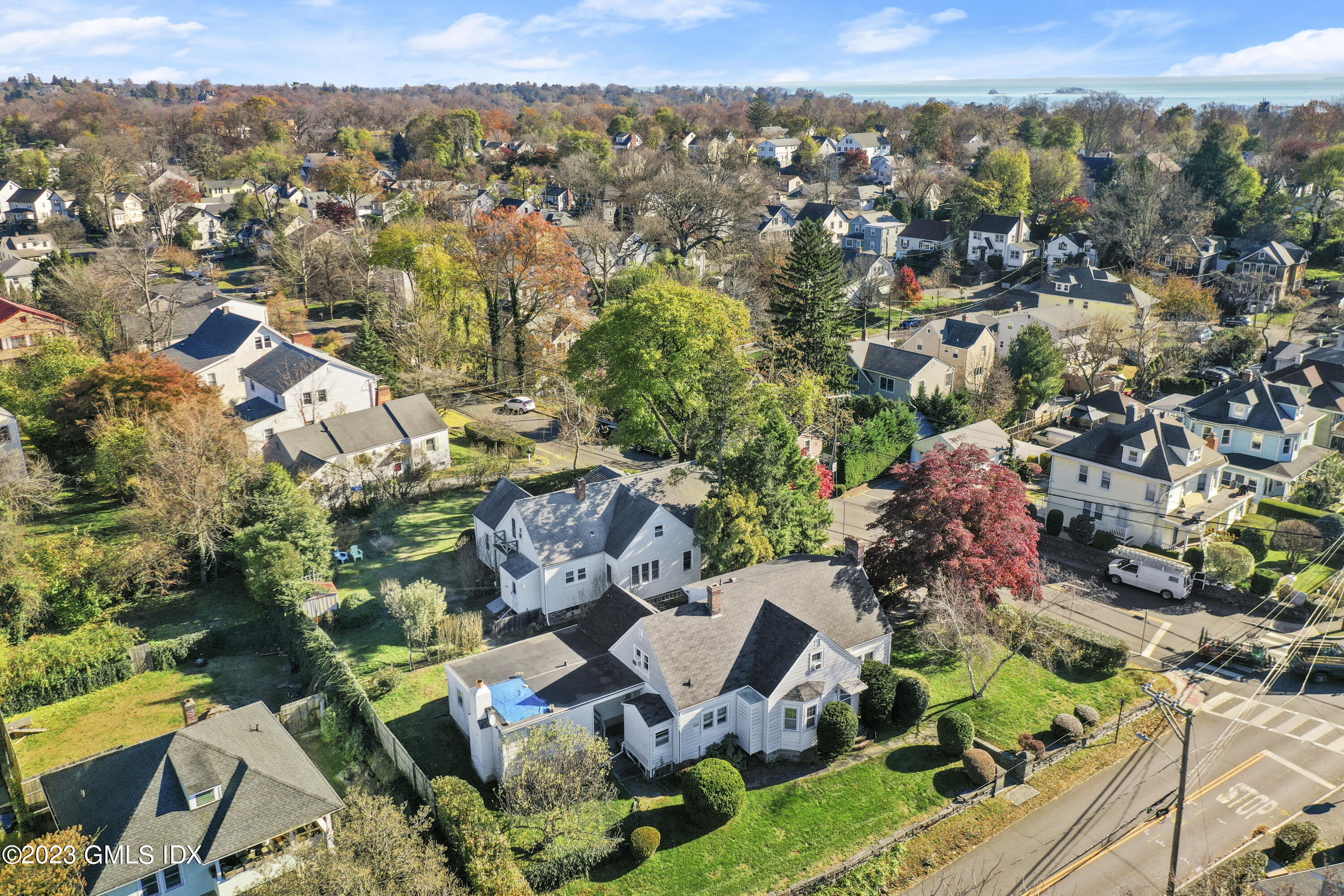 an aerial view of residential houses with outdoor space