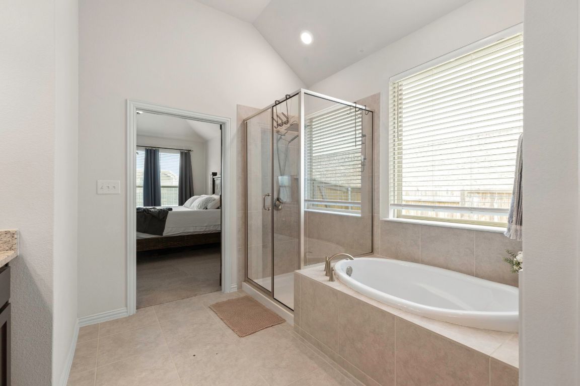 232 Silver Pass Kyle, TX 78640 - Photo 24 of 39 Soaking tub with spa feel & Rainfall shower in private suite