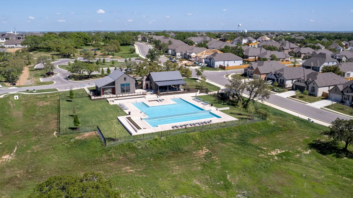 232 Silver Pass Kyle, TX 78640 - Photo 37 of 39 Here’s your go-to spot for weekend hangs, community events, or just a little “me time.” The modern clubhouse pairs beautifully with the pool and sun deck, offering the perfect backdrop for both social gatherings and quiet escapes.