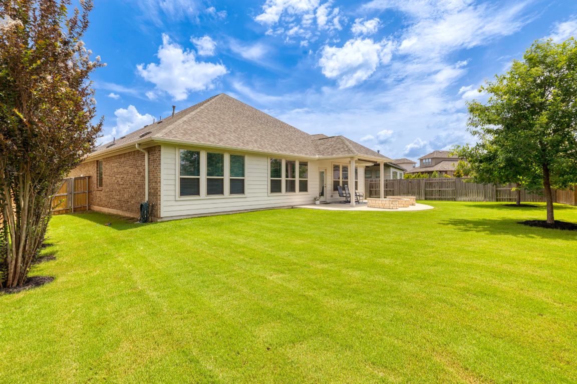 232 Silver Pass Kyle, TX 78640 - Photo 10 of 39 A beautifully manicured yard with mature trees, plenty of room to play, and tons of privacy. Whether it’s hosting backyard barbecues, tossing the football, or watching the kids run wild this oversized outdoor space checks every box for functional and fun living.
