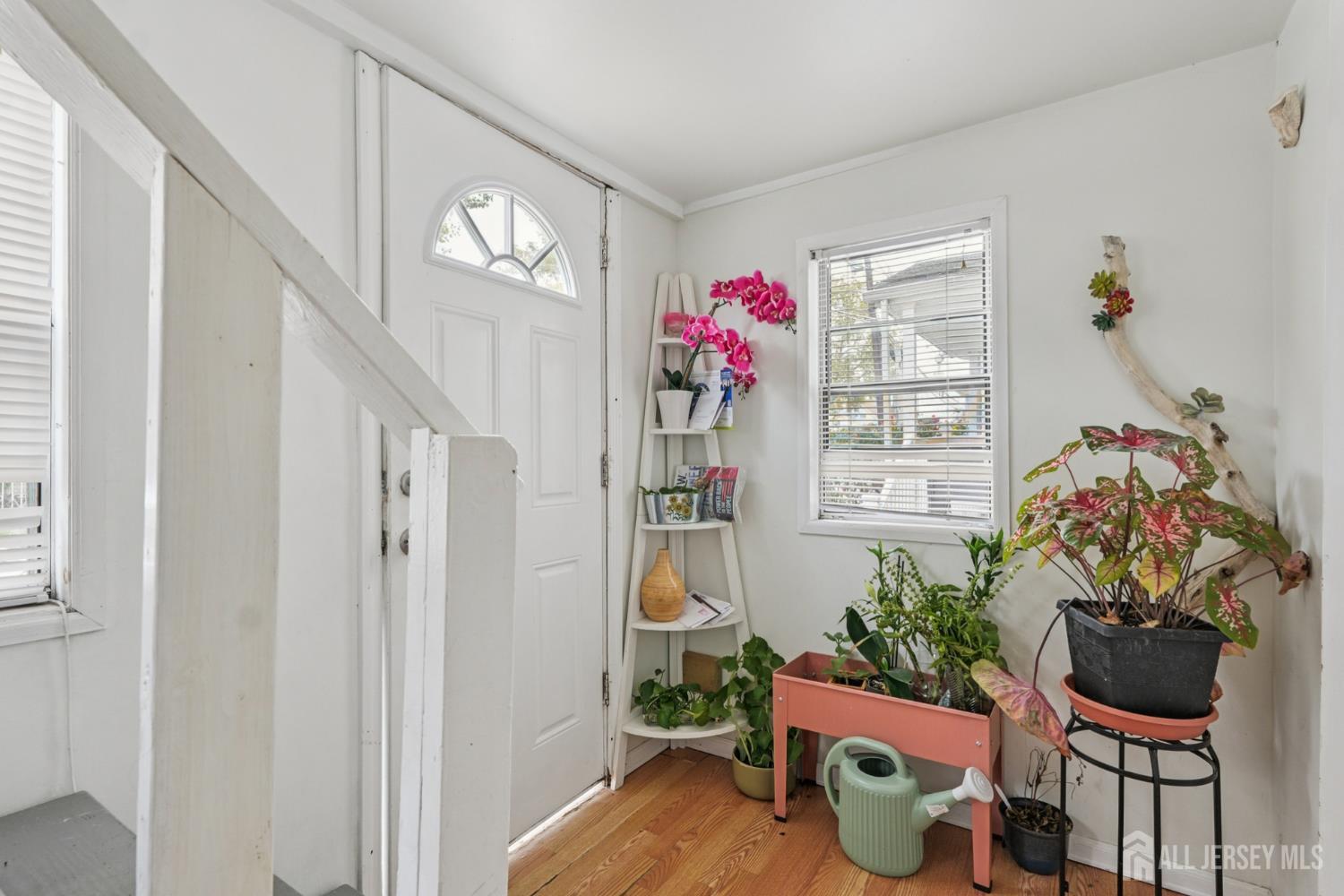 655 Charles Street Perth Amboy, NJ 08861 - Photo 12 of 29 a living room with furniture and a potted plant