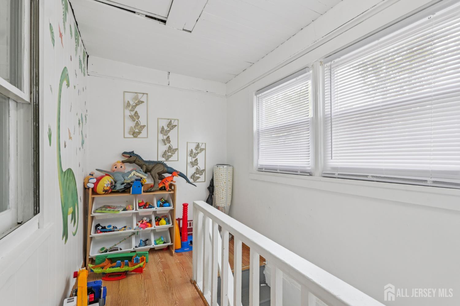 655 Charles Street Perth Amboy, NJ 08861 - Photo 15 of 29 a children room with toys and a window