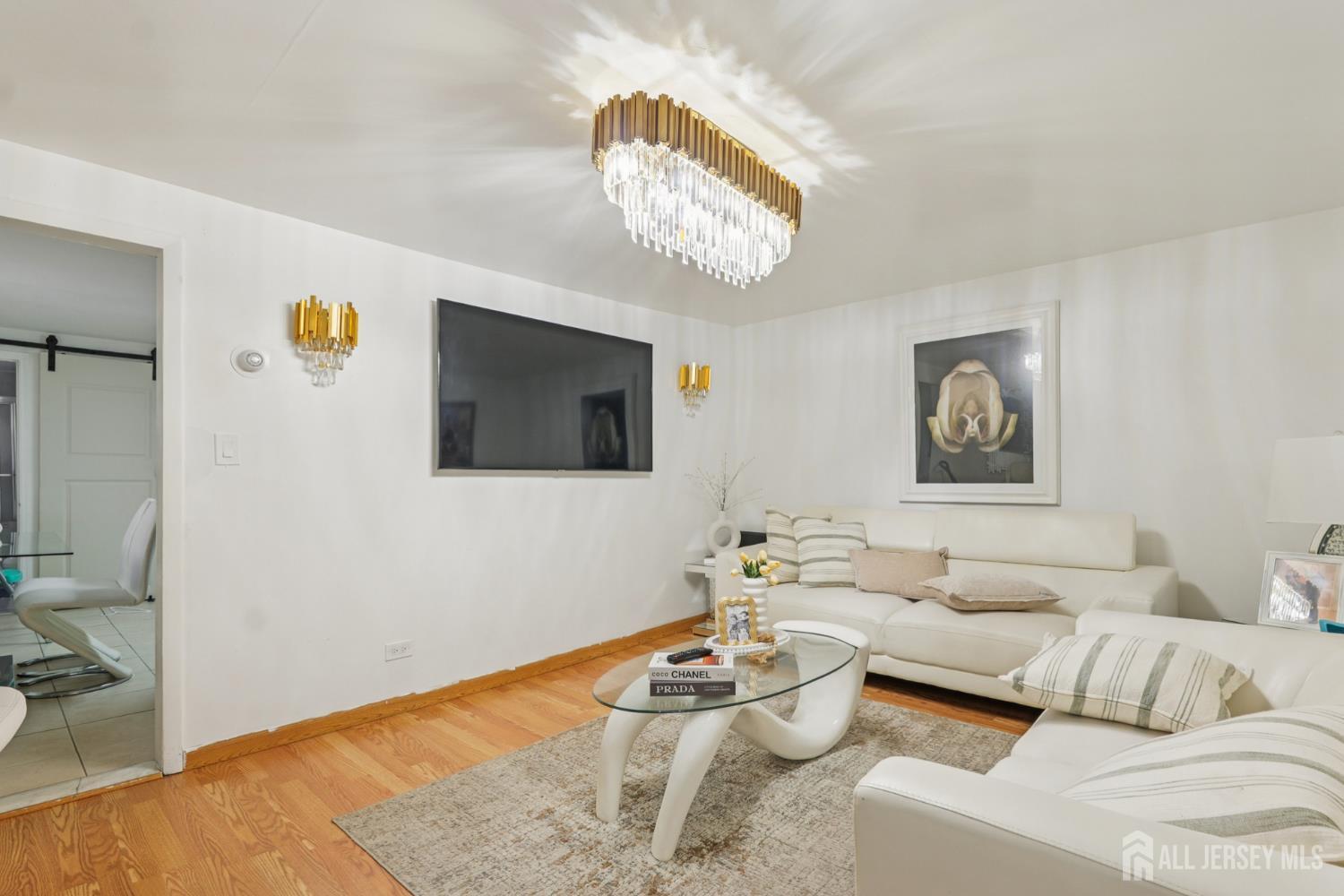 655 Charles Street Perth Amboy, NJ 08861 - Photo 16 of 29 a living room with furniture and a flat screen tv