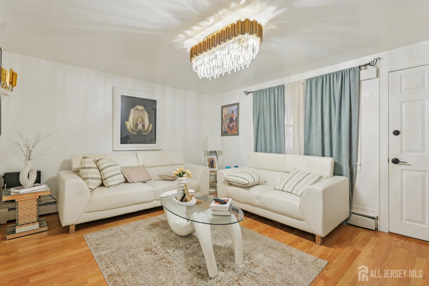 655 Charles Street Perth Amboy, NJ 08861 - Photo 17 of 29 a living room with furniture and a large window