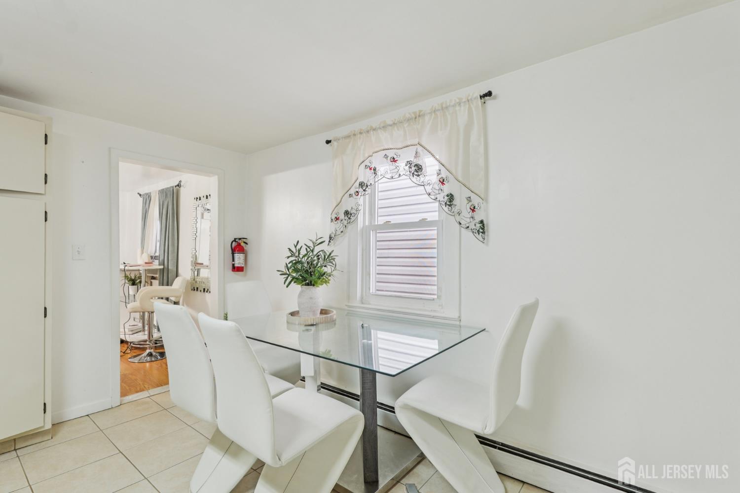 655 Charles Street Perth Amboy, NJ 08861 - Photo 19 of 29 a view of a dining room with furniture and wooden floor