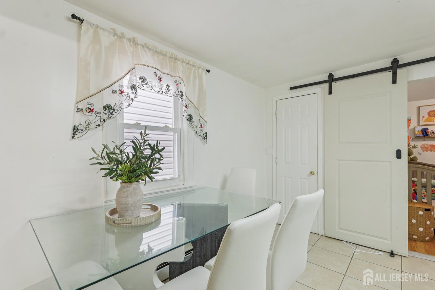 655 Charles Street Perth Amboy, NJ 08861 - Photo 20 of 29 a vase of flowers sitting on a table