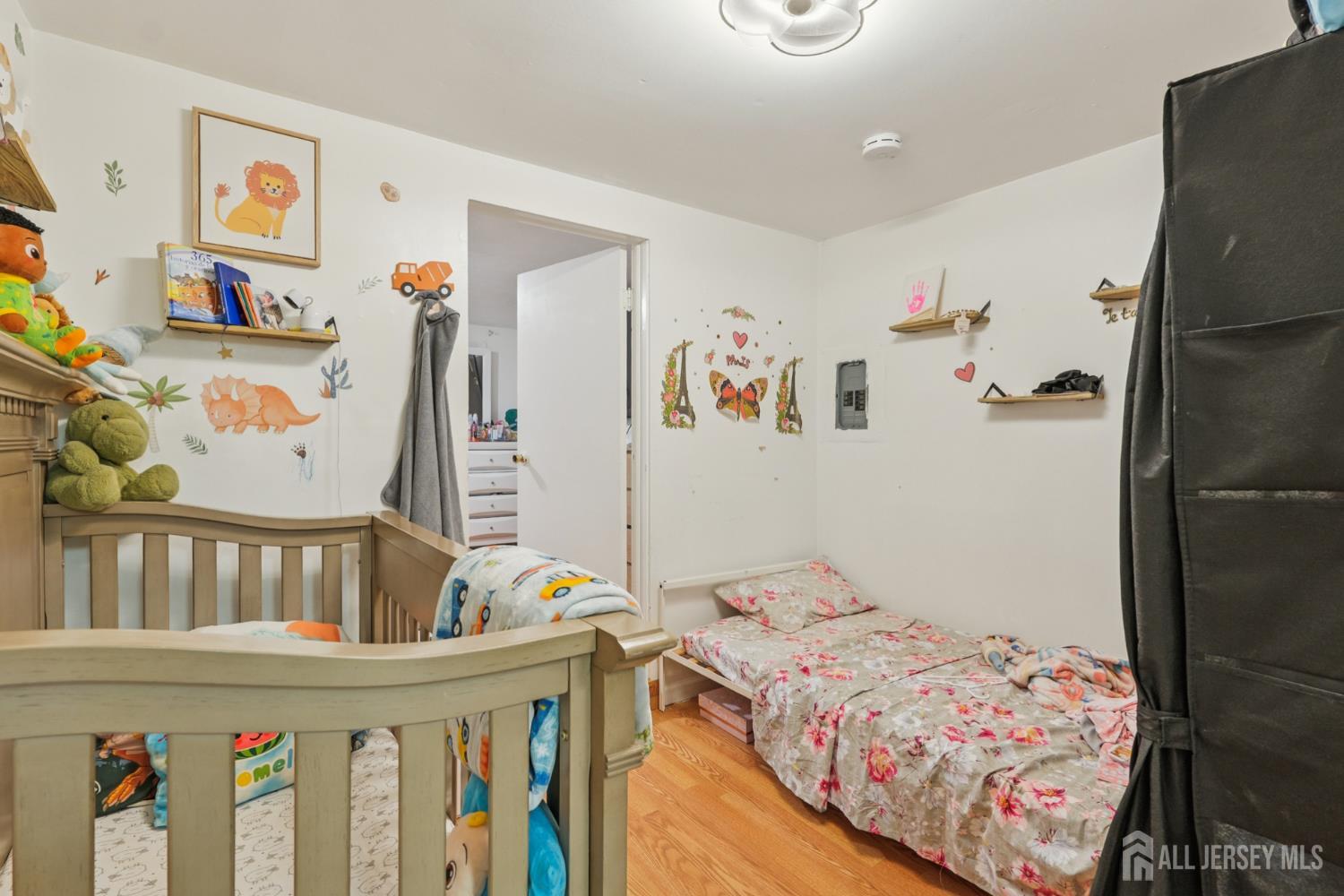 655 Charles Street Perth Amboy, NJ 08861 - Photo 24 of 29 a bedroom with furniture and baby bed