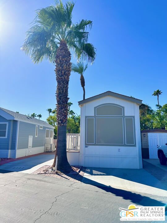 69801 Ramon Road, Unit 228 Cathedral City, CA 92234 - Photo 12 of 12 a front view of a house with garden