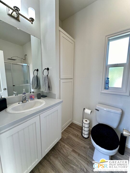 69801 Ramon Road, Unit 228 Cathedral City, CA 92234 - Photo 7 of 12 a bathroom with a toilet sink and mirror