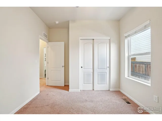 a big room with windows and closet