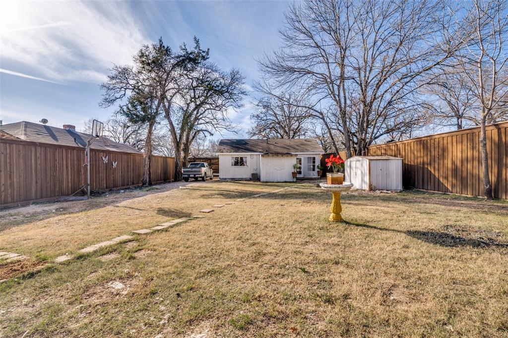650 Pleasant Oaks Drive Dallas, TX 75217 - Photo 24 of 25 a house with trees in front of it
