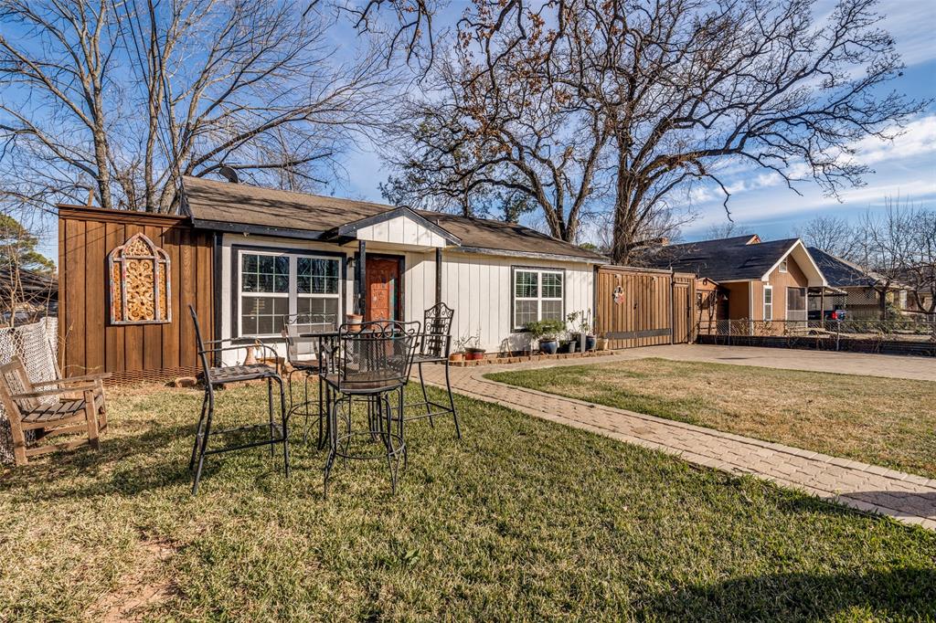 650 Pleasant Oaks Drive Dallas, TX 75217 - Photo 3 of 25 a view of house with outdoor space and seating area