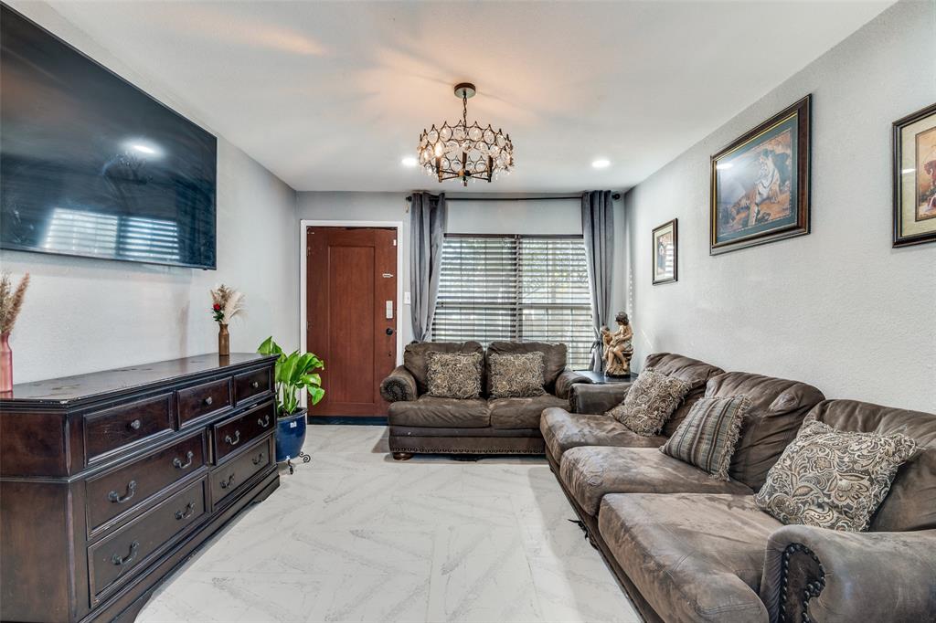 650 Pleasant Oaks Drive Dallas, TX 75217 - Photo 4 of 25 a living room with furniture ceiling fan and a window