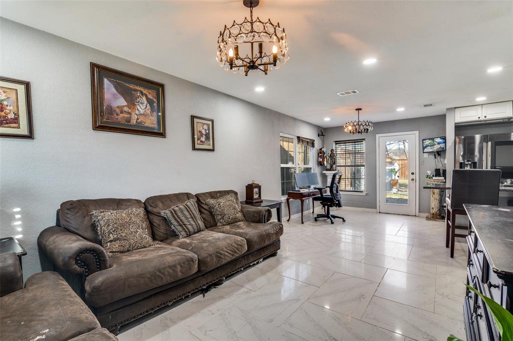 650 Pleasant Oaks Drive Dallas, TX 75217 - Photo 7 of 25 a living room with furniture and wooden floor