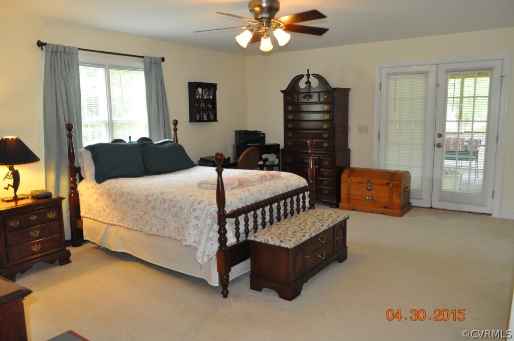 18500 Woodsons Mill Road Beaverdam, VA 23015 - Photo 6 of 24 Master bedroom with carpet, ceiling fan, 2 closets
