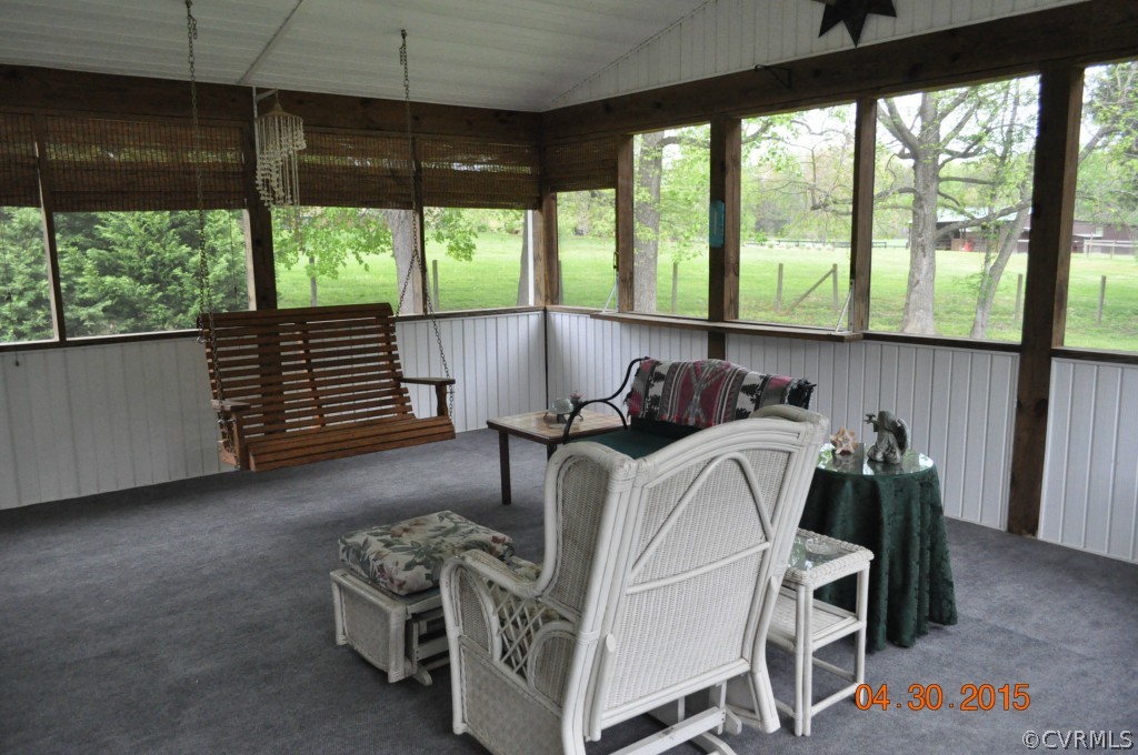 18500 Woodsons Mill Road Beaverdam, VA 23015 - Photo 9 of 24 Screened porch with vaulted ceiling and ceiling fa