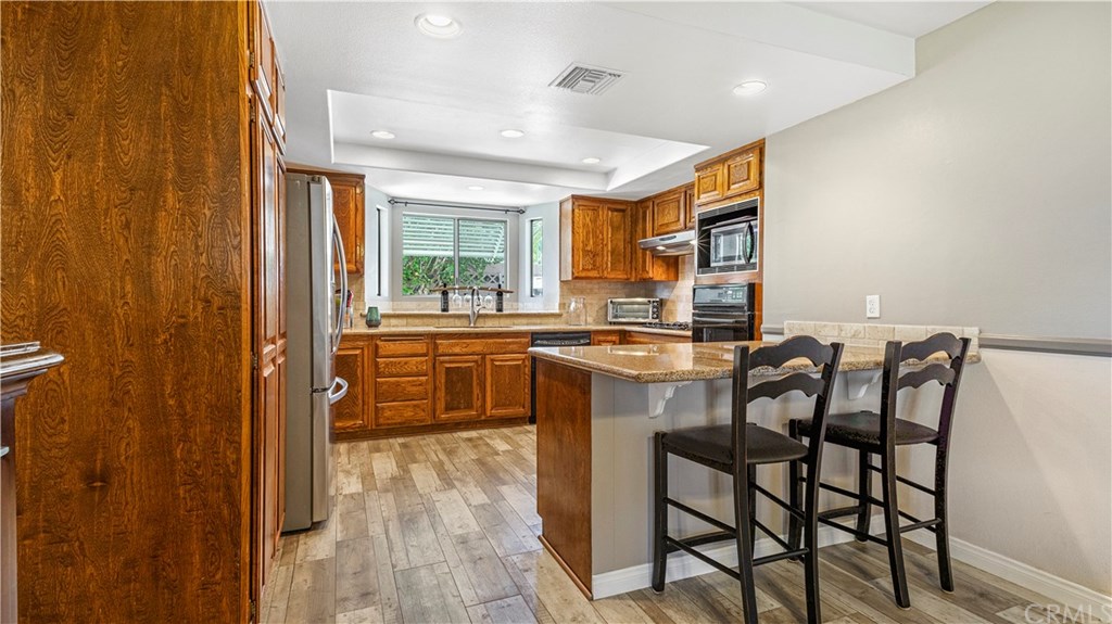 23891 Silverbay Drive Lake Forest, CA 92630 - Photo 7 of 31 Counter seating for that quick breakfast and cup of coffee!