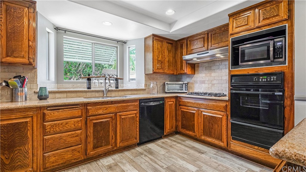 23891 Silverbay Drive Lake Forest, CA 92630 - Photo 8 of 31 Granite countertops and lots of counter space!