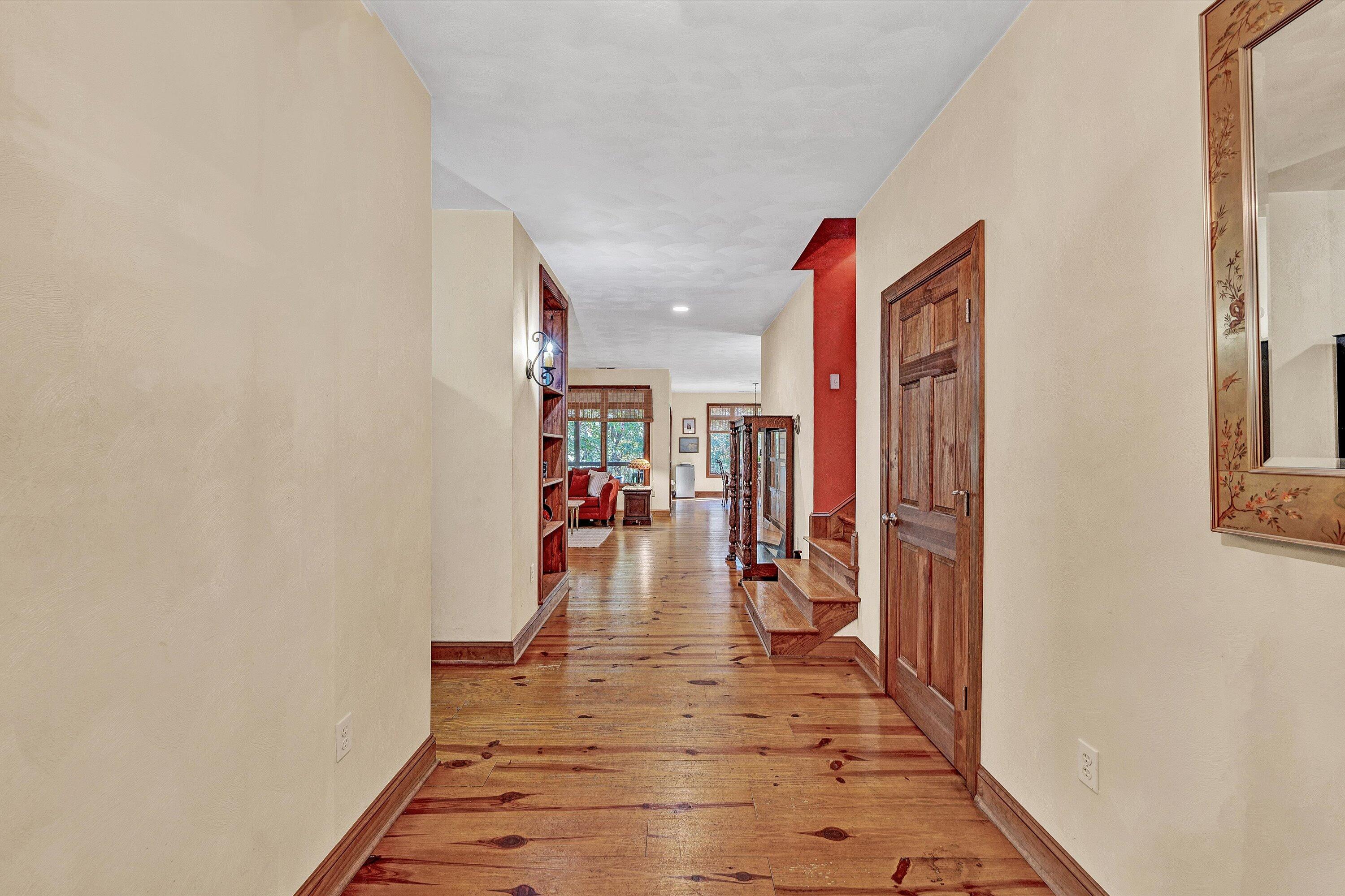 30 Boulder Point Drive Hardy, VA 24101 - Photo 12 of 68 a hallway with a view of living room with wooden floor