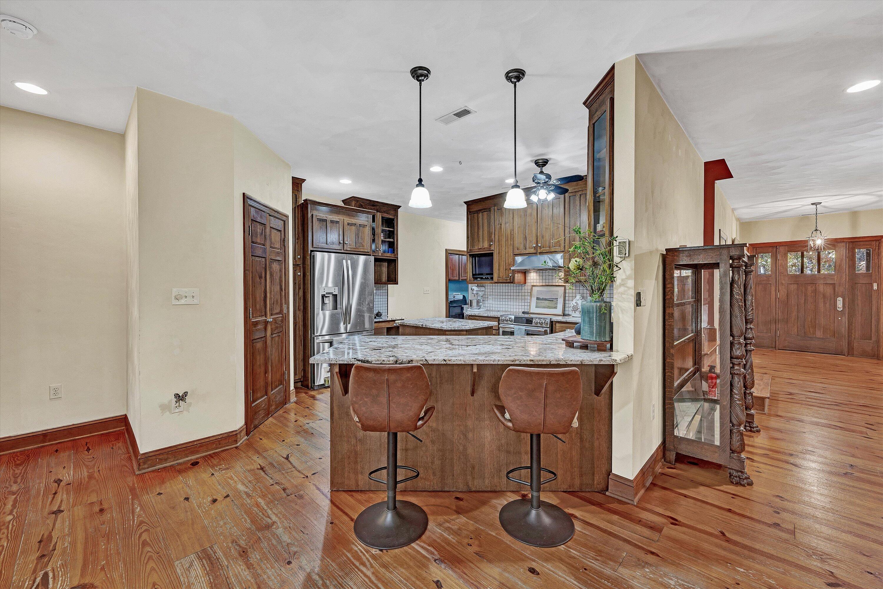 30 Boulder Point Drive Hardy, VA 24101 - Photo 20 of 68 a kitchen with stainless steel appliances granite countertop a table chairs stove and refrigerator