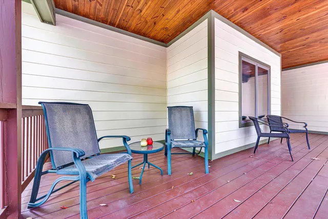 a view of a patio with wooden floor