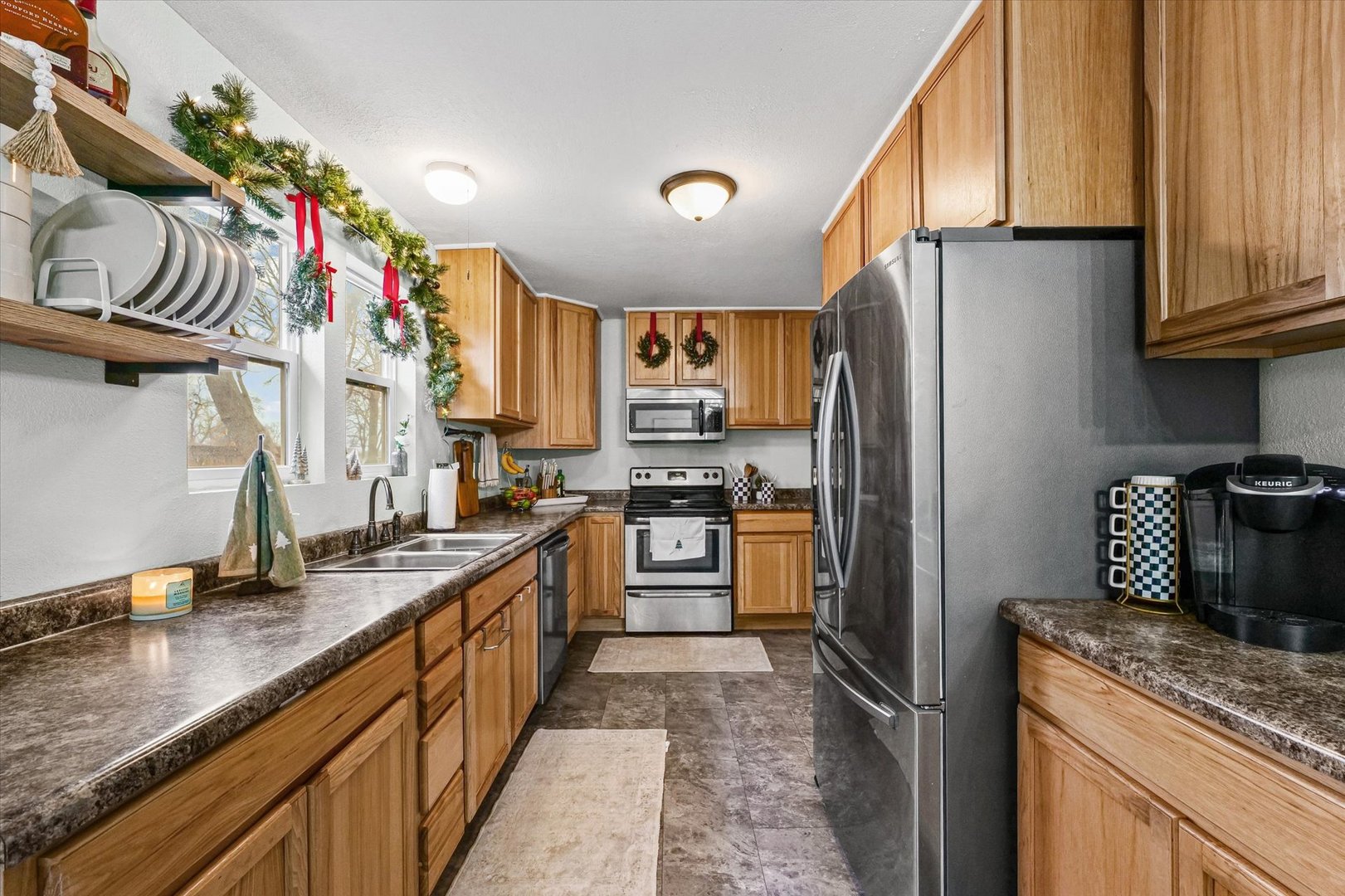113 Witt Park Road Sidney, IL 61877 - Photo 11 of 29 a kitchen with granite countertop a refrigerator stove and sink