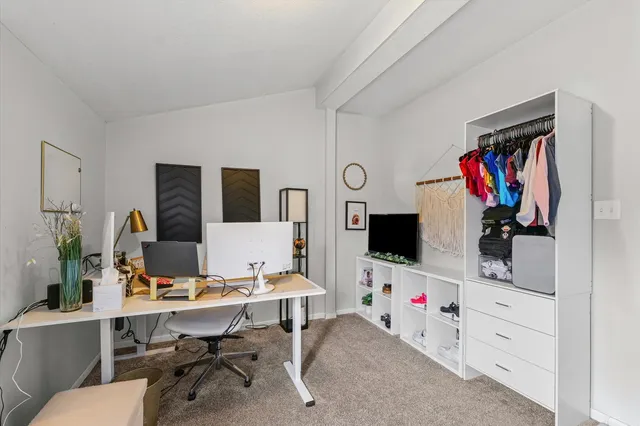 a bedroom with bed and a window