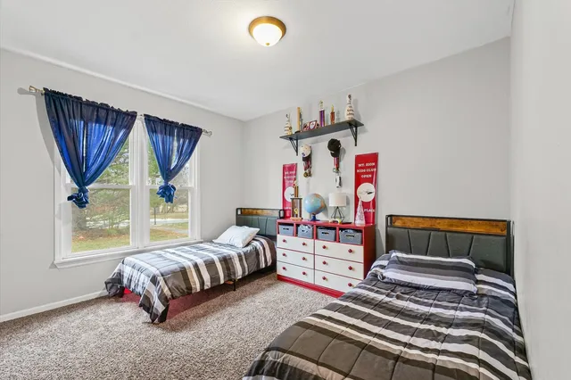 a bedroom with furniture and a bed