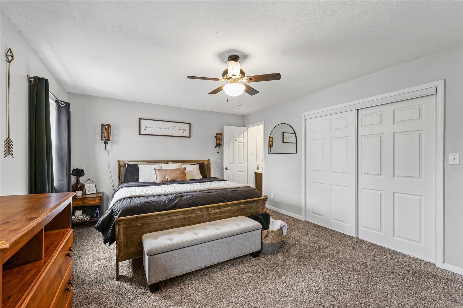 113 Witt Park Road Sidney, IL 61877 - Photo 22 of 29 a bedroom with a bed and a chandelier