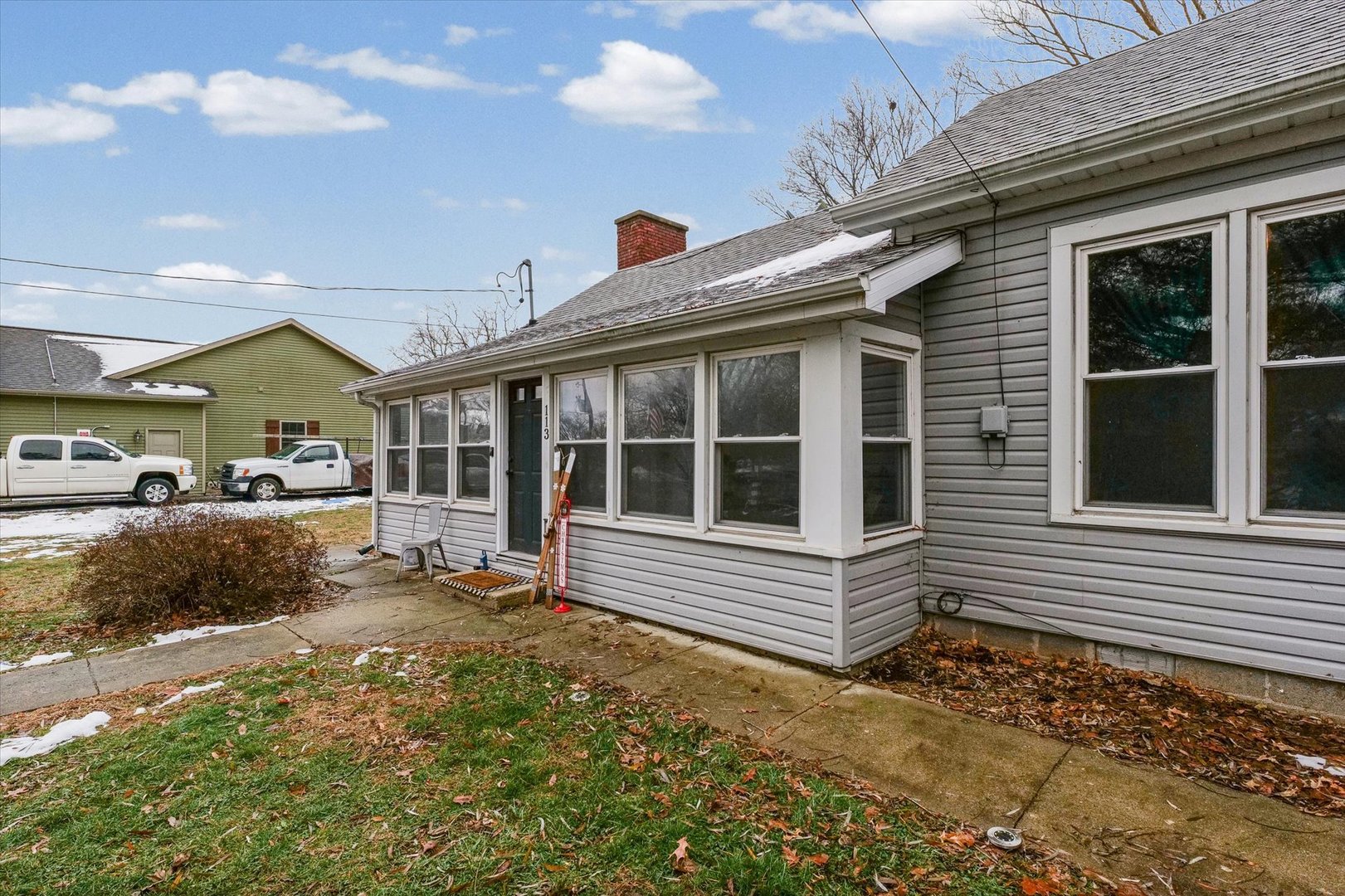 113 Witt Park Road Sidney, IL 61877 - Photo 3 of 29 a front view of a house with a yard