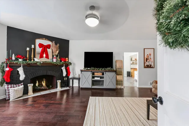 a living room with furniture and a fireplace or television