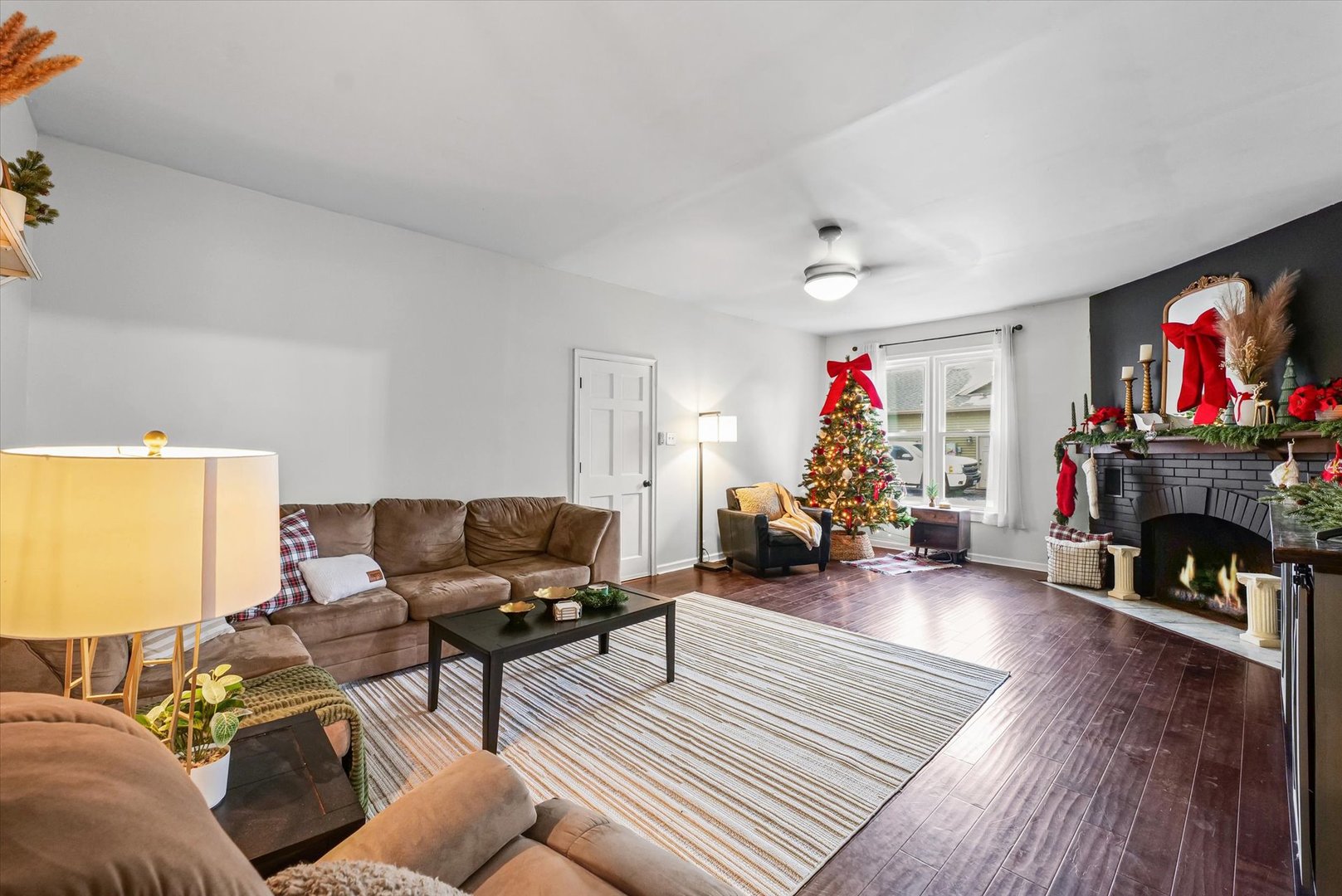 113 Witt Park Road Sidney, IL 61877 - Photo 7 of 29 a living room with furniture and a fireplace