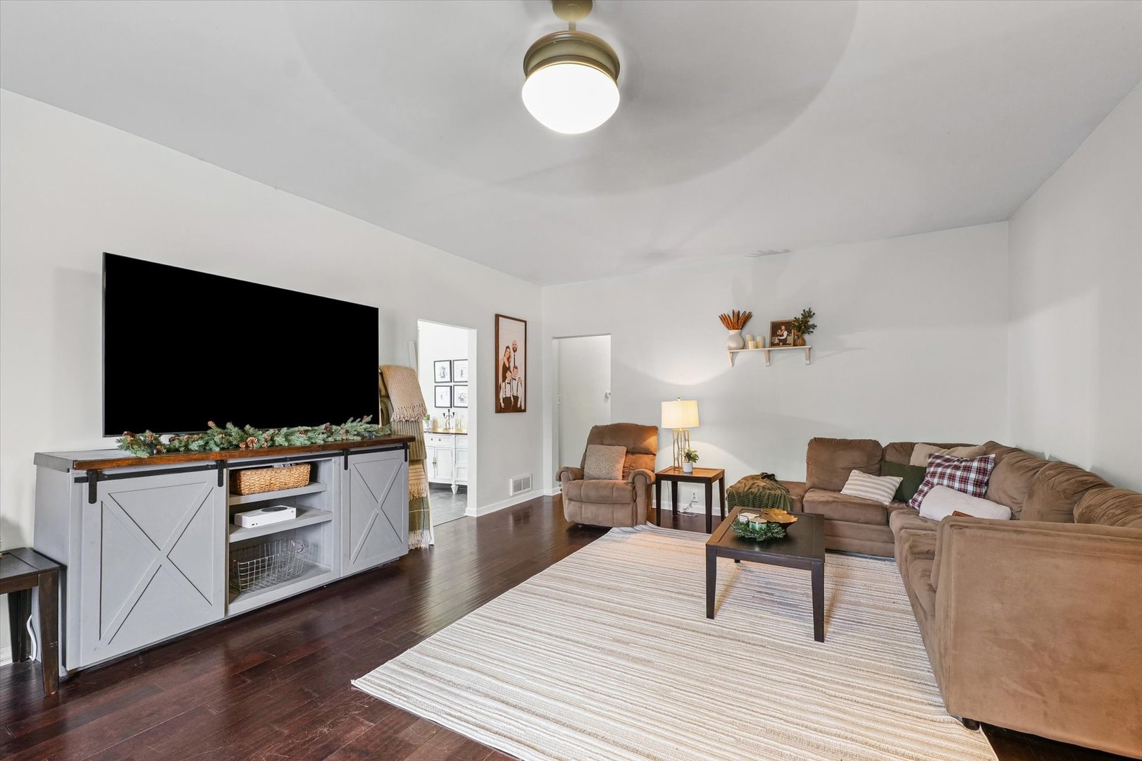 113 Witt Park Road Sidney, IL 61877 - Photo 8 of 29 a living room with furniture and a flat screen tv