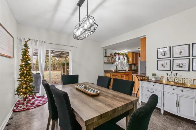 a large dining room with a table and chairs