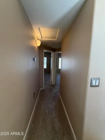 a view of hallway with windows