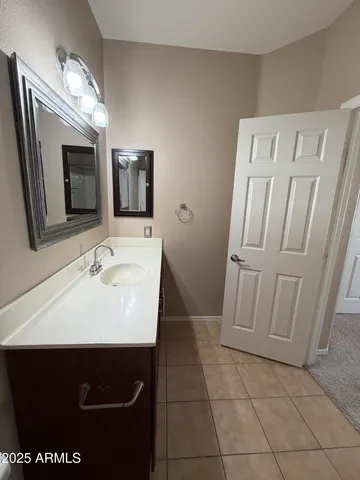 en empty room with windows and ceiling fan