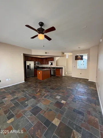a view of a livingroom with a fireplace furniture and a chandelier